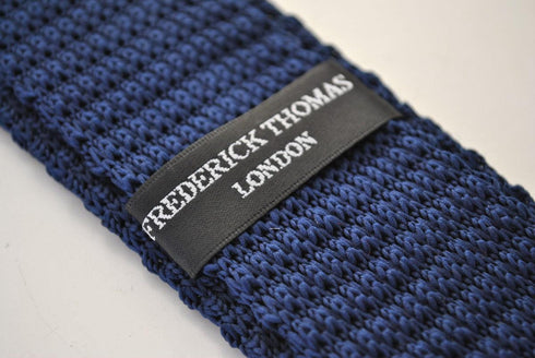 navy blue skinny knitted tie with white polka dots